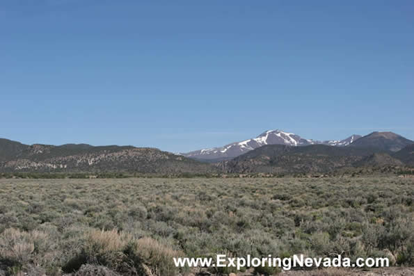 Flat Valley and Snowy Peaks